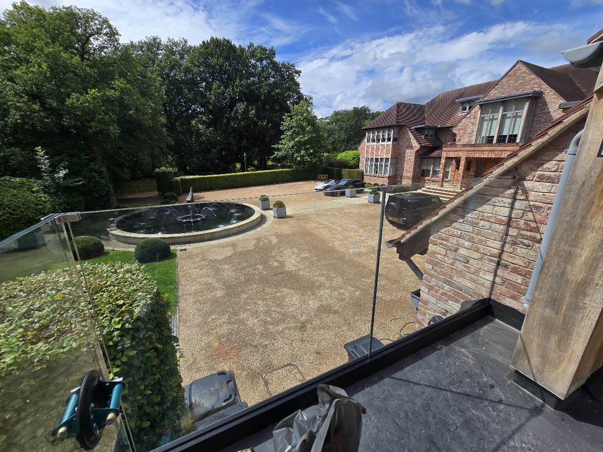 Frameless glass balustrade on a country house roof terrace — Manchester Balustrades installation
