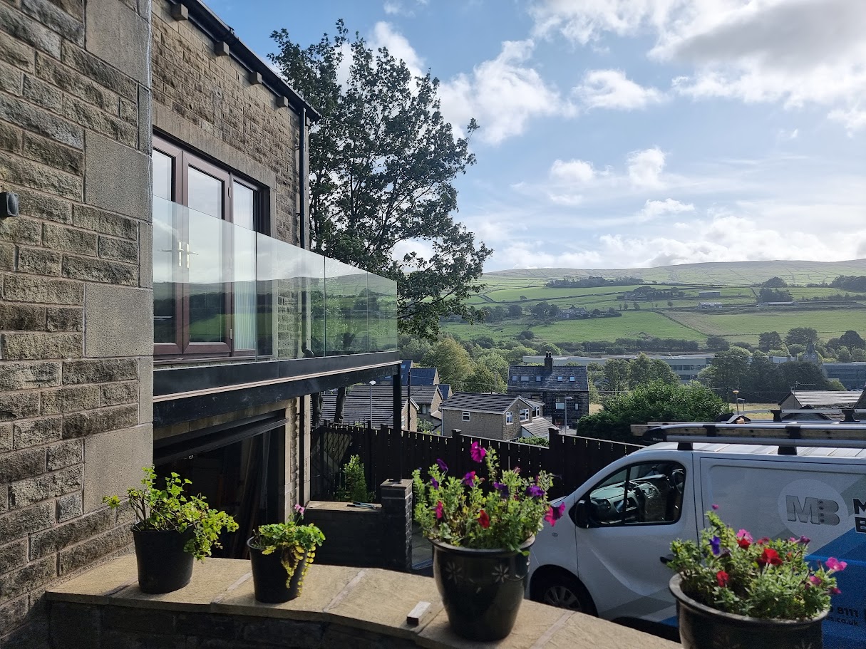 A frameless glass balcony in Mossley — further view of the completed installation